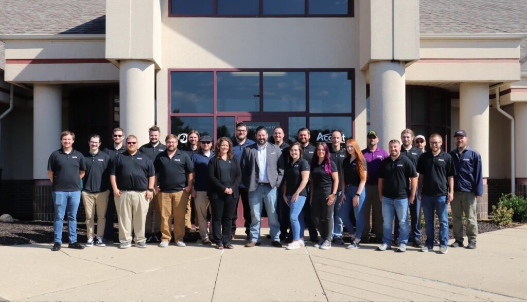 Group photo of Accent Consulting team standing outside